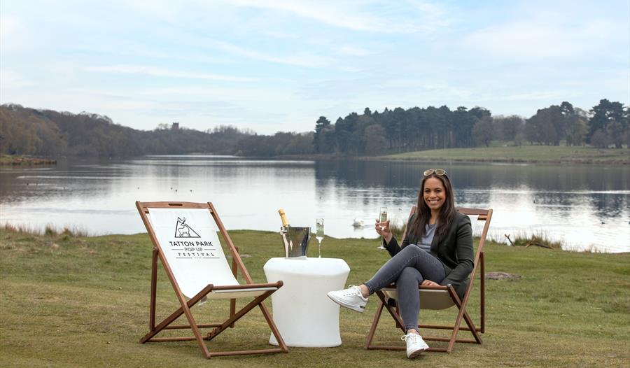 Tatton park, lake view, woman with a glass of champagne