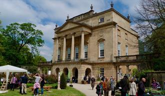 Photograph of the Holburne Museum facade with gardening and plant stalls in front, as part of the Holburne Friends annual Plant Sale