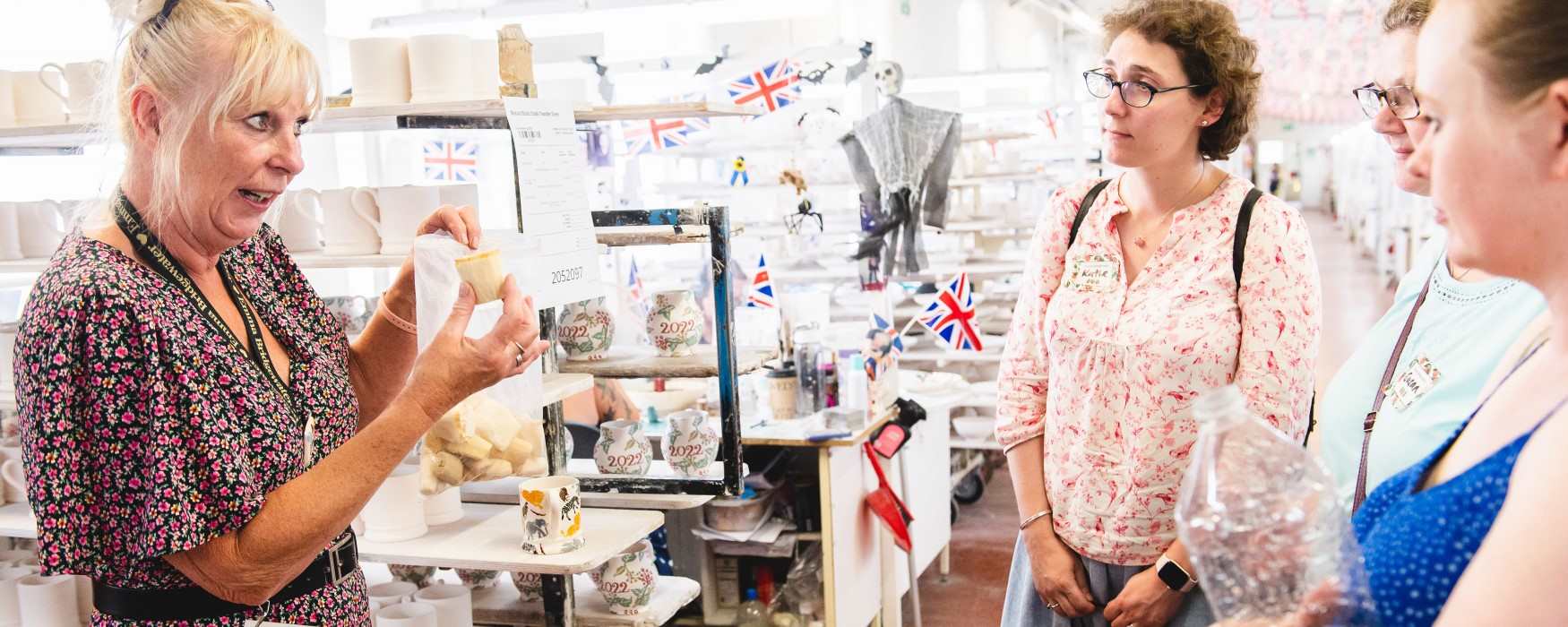 A group of ladies enjoying a factory tour at Emma Bridgewater