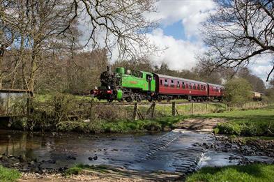 A train passes the ford at Churnet Valley Railway, Staffordshire