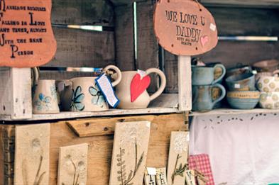 Image of a pottery stall at a market.
