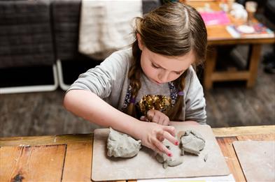 Girl modelling clay
