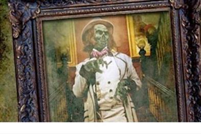Image of a skeleton painting in an old frame.