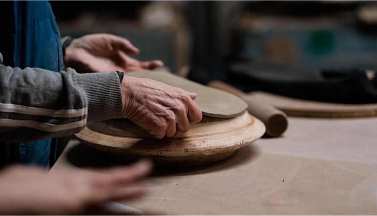 Person moulding clay