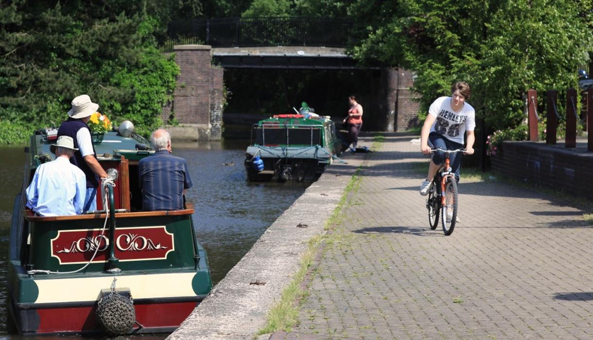 Cyclist and boaters on the Trent & Mersey Canal