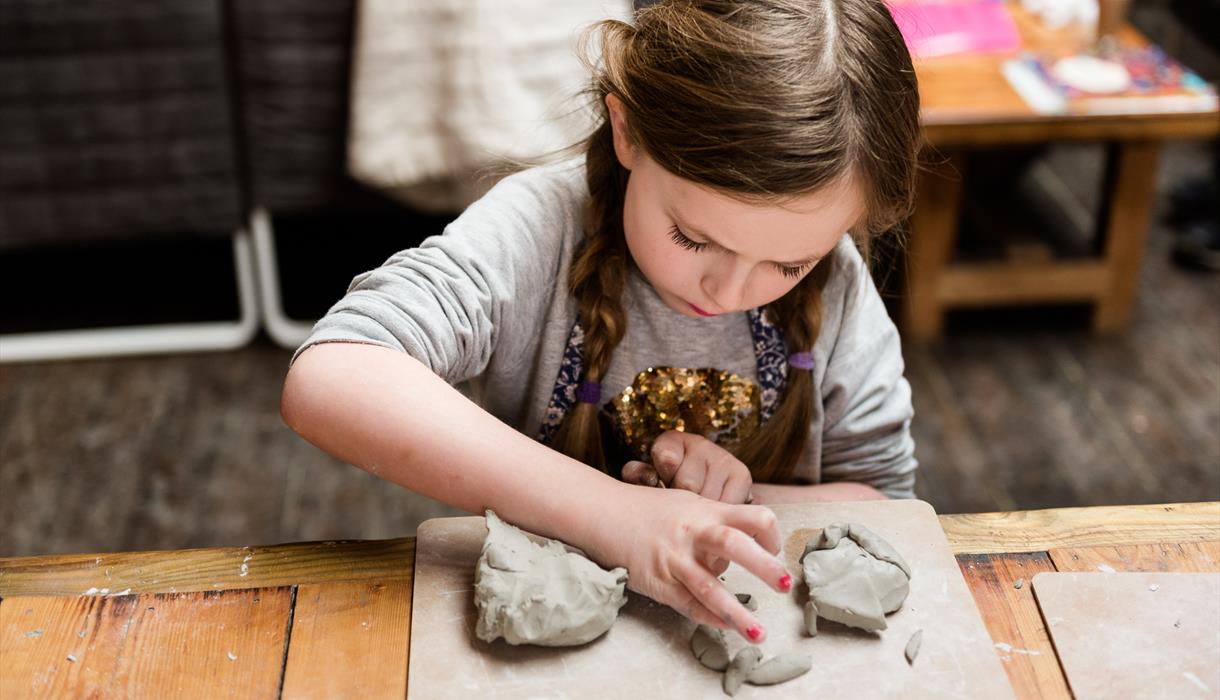 Girl modelling clay