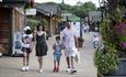 Family walking through the Shopping Village at the Trentham Estate.