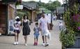 Family walking through Trentham Shopping Village