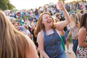 A visitor enjoys great live music at one of The Trentham Estate's Summer Concerts
