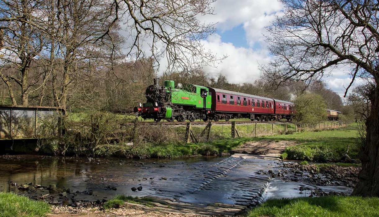A train passes the ford at Churnet Valley Railway, Staffordshire