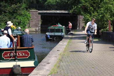 Cyclist and boaters on the Trent & Mersey Canal