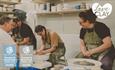 A group of people enjoying a pot throwing workshop at LoveClay Ceramics Centre