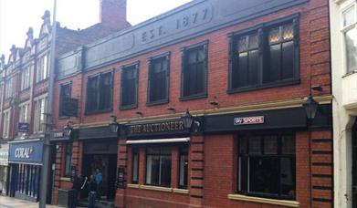 The Auctioneer Sports Bar