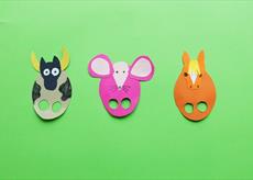 Some colourful card puppets with finger holes cut out