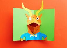 A card with a creature on it with a pop up mouth