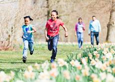 Children running through the gardens at Polesden Lacey