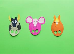 Some colourful card puppets with finger holes cut out