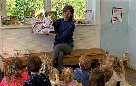 Author Lucy Reynolds reading her Hedgehog book to children