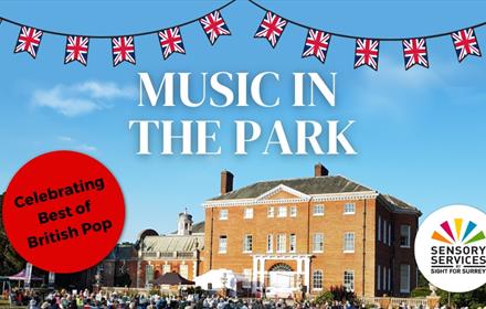 Music in the Park promotional image of Hatchlands Park House, a large, Grade I listed, stately house with Union Jack bunting on the top, surrounded by