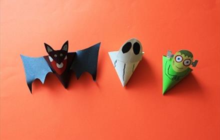 Set of 3 cones one decorated to look like a ghost, one decorated to look like a bat and one decorated to look like a monster