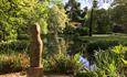 The Hannah Peschar Sculpture Garden - 'Woodland Torso' Paul Vanstone, evening light at Black & White Cottage