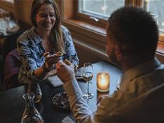 Two persons eating together at a table