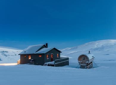 Juva Cabin underneath a blue sky