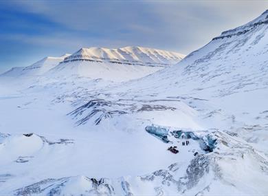 Snowmobile tour group taking a break