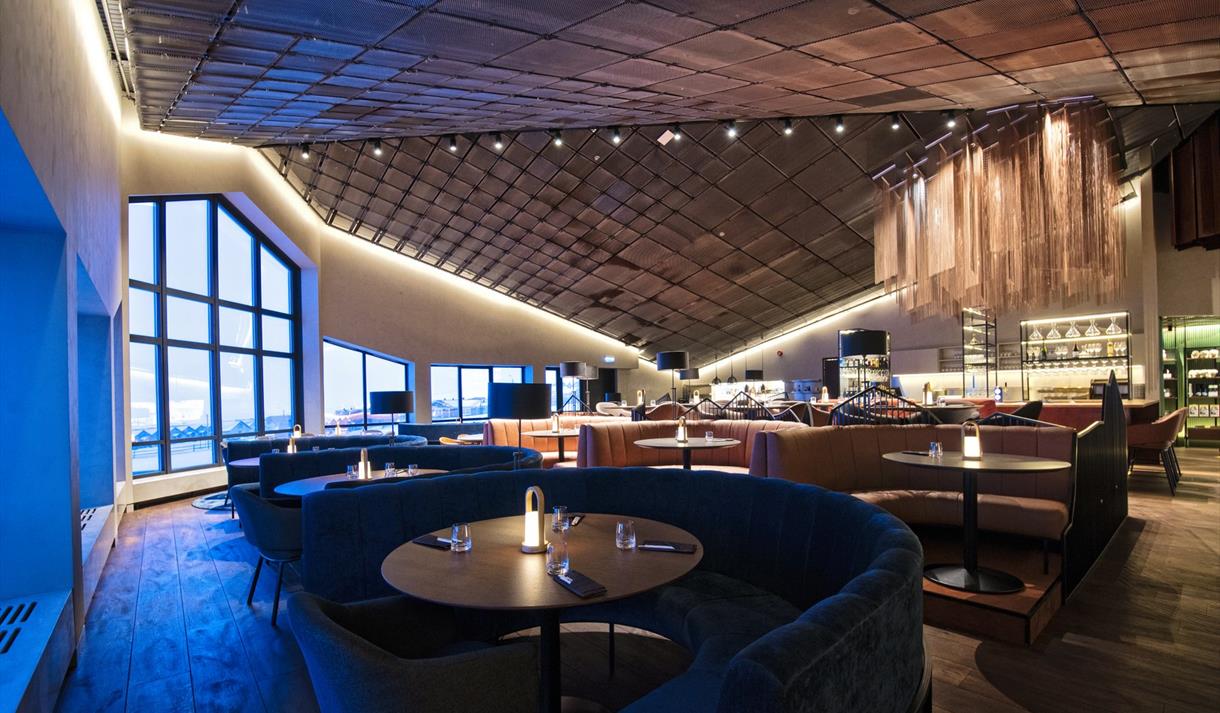 A restaurant dining area with decked tables