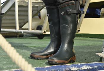 A pair of rubber boots on a ship's deck