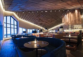 A restaurant dining area with decked tables