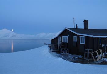 View from Slettebu over Van Mijenfjorden with the moon shining in the distance