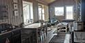 Living room and kitchen inside a wilderness cabin