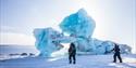 People in front of an ice formation