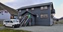 Spitzbergen Reisen's office seen from the outside, with a car parked in front of it