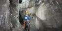 A person inside an ice cave