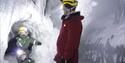 A guide and two children inside the ice cave