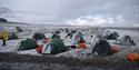 Snow-covered tents on a camping site