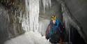 A guide inside an ice cave