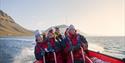 Guests having fun on board a RIB boat