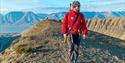 Person standing on a mountain top