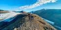 Person standing on a mountain top