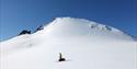 A person skiing with a sled