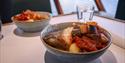 Codfish dinner served in a bowl