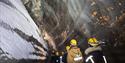 A group of persons inside an ice cave