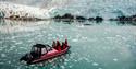 A RIB boat in front of the Nordenskiöld Glacier