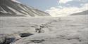 A shallow meltwater channel on top of a glacier