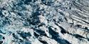 A glacier with crevasses seen from above