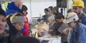 A long line of tables and chefs selling food to guests in Taste Svalbard's festival tent