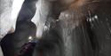 A person inside an ice cave